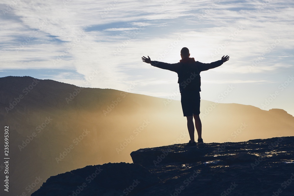 Tourist on the edge of cliff