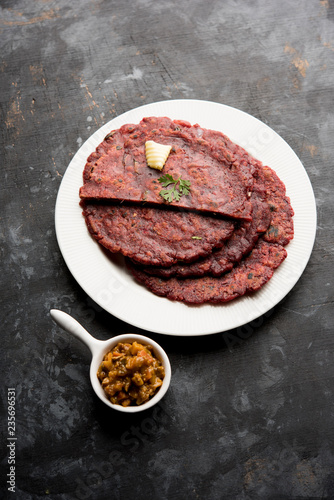 Ragi Roti made from finger millet from India is extremely rich in proteins served with pickle or achar. selective focus photo