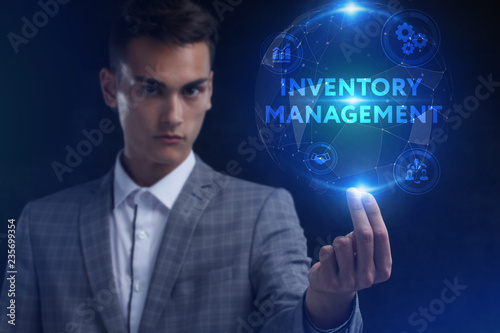 The concept of business, technology, the Internet and the network. A young entrepreneur working on a virtual screen of the future and sees the inscription: Inventory management