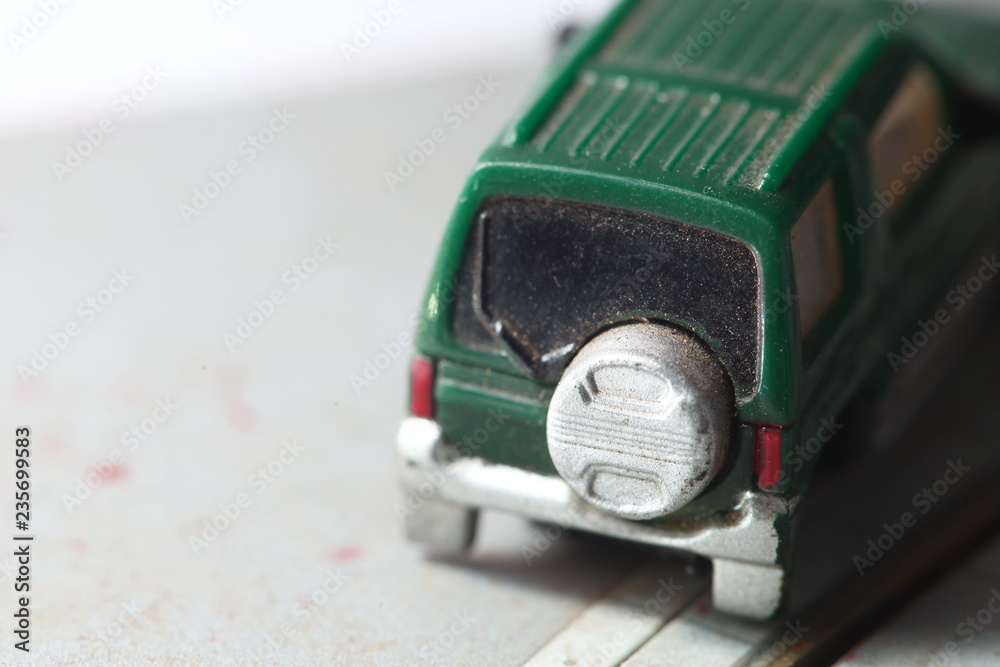 Old and dirty miniature plastic car model scene. Old and dirty miniature plastic car model scene.