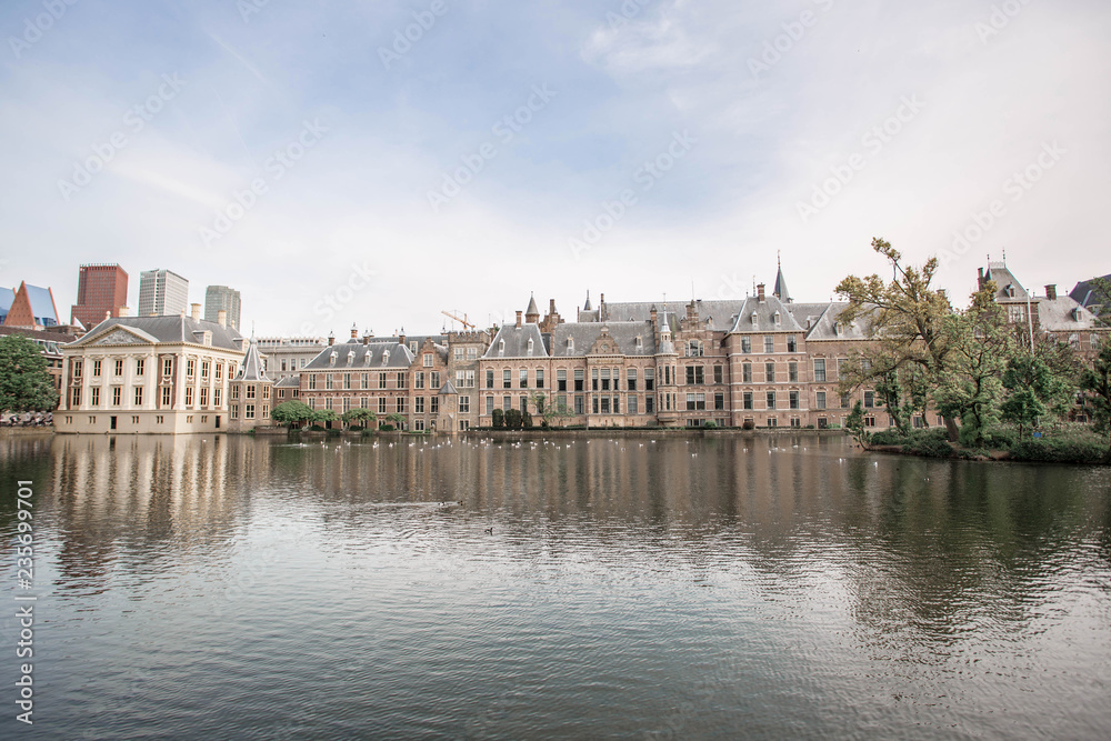 Amazing Binnenhof Palace in The Hague (Den Haag). Dutch Parliament buildings. Famous castle with fountains in front of it. The Netherlands, The Hague. 