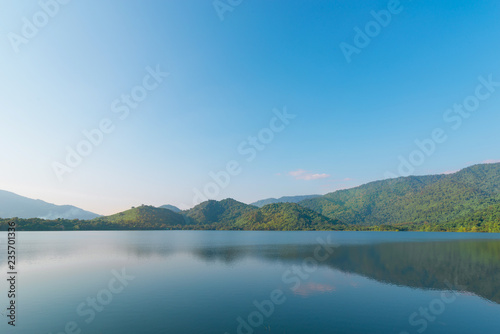 landscape with mountains, forest and a river in front. beautiful scenery