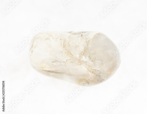 tumbled rock crystal ( quartz) gemstone on white