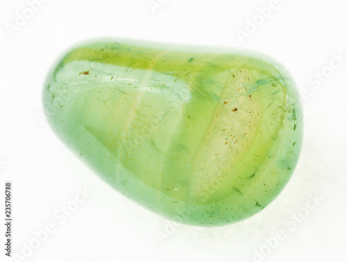 tumbled green transparent Calcite stone on white
