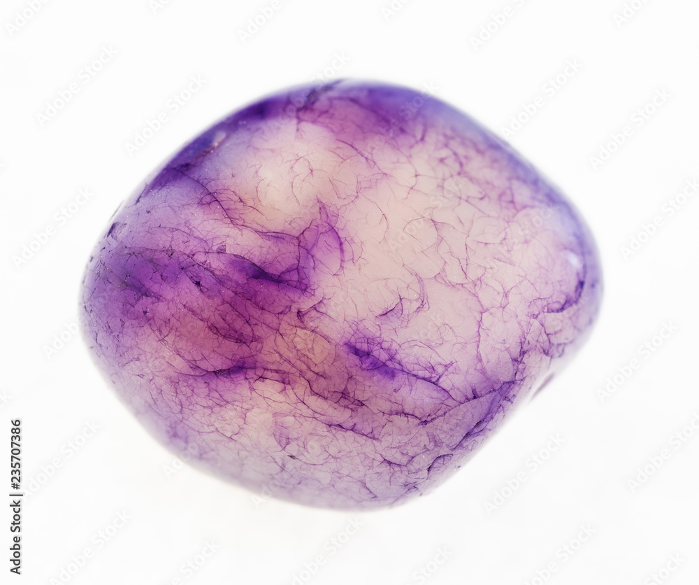 polished Amethyst gem stone on white polished Amethyst gem stone on white