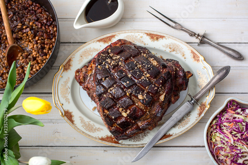 Close up of fresh roasted ham served on plate photo