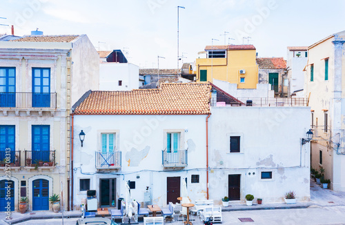 Syracuse, Sicily, Italy - ancient street with old buildings in the seafront of Ortygia (Ortigia) Island © Inna