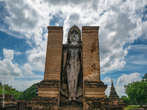 Buddha stand Statue in Wat mahathat Temple Area At sukhothai historical park,Sukhothai city Thailand