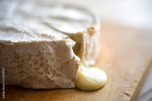 Close up of melting camembert cheese on cutting board