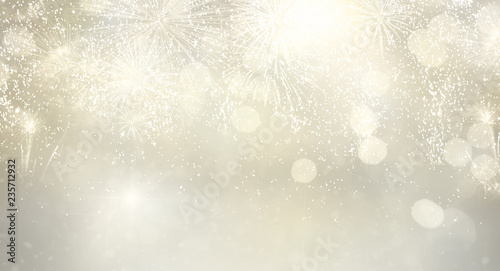 Abstract festive silver winter bokeh background with fireworks and bokeh lights banner