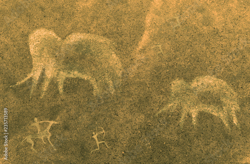 image of ancient mammoths and hunters on the cave wall. the history of the antiquities era.