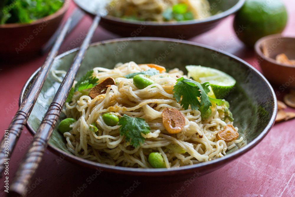 Close up pan fried noodles served in bowl Close up pan fried noodles served in bowl