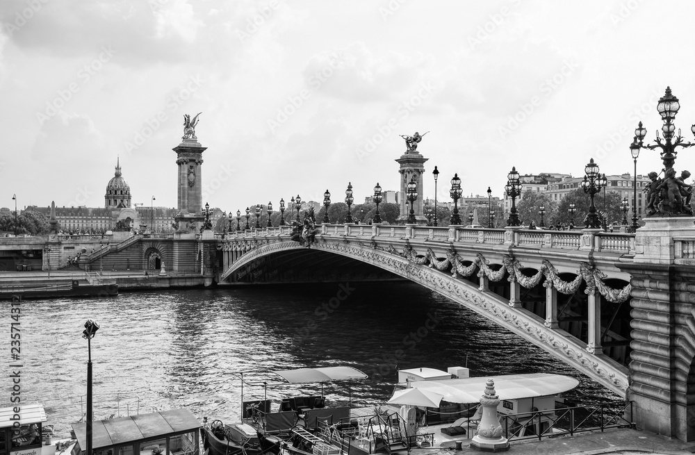 PARIS, FRANCE, SEPTEMBER 5, 2018 - View of Alexander III Bridge over the River Seine, with the Hotel des Invalides on the background in Paris, France
