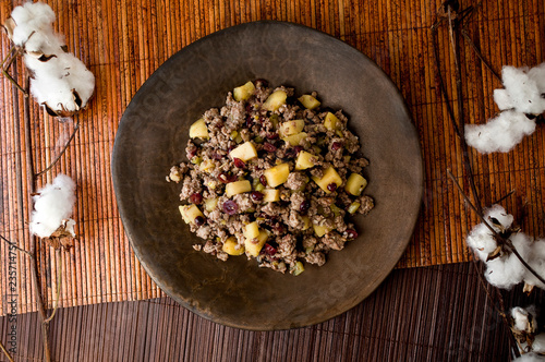 Overhead view of spiced apple sausage stuffing with cranberries and brandy photo