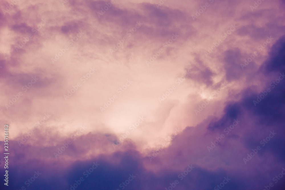 Pink and violet, dark dramatic clouds in sky. Copy space. For background and wallpaper