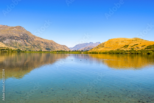 Peaceful and calm scene  relaxing hilly and lake landscape. Lake Hayes  Queenstown  New Zealand.