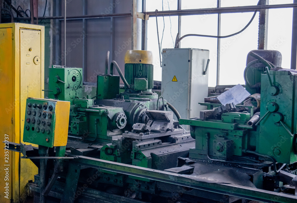 Machining of metal by cutting on a turning and milling machine. Industrial machine old design. Lathe equipment. Machining of metal by cutting on a turning and milling machine. Industrial machine old design. Lathe equipment.