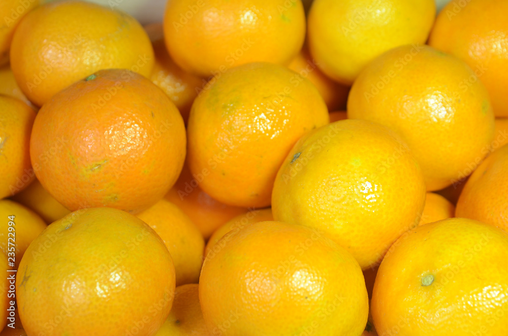 A lot of orange clementines, seeen in slight side light. A lot of orange clementines, seeen in slight side light.
