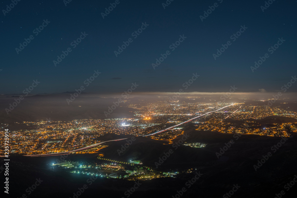 Foggy night mountaintop view of suburban Simi Valley near Los Angeles in Ventura County California.