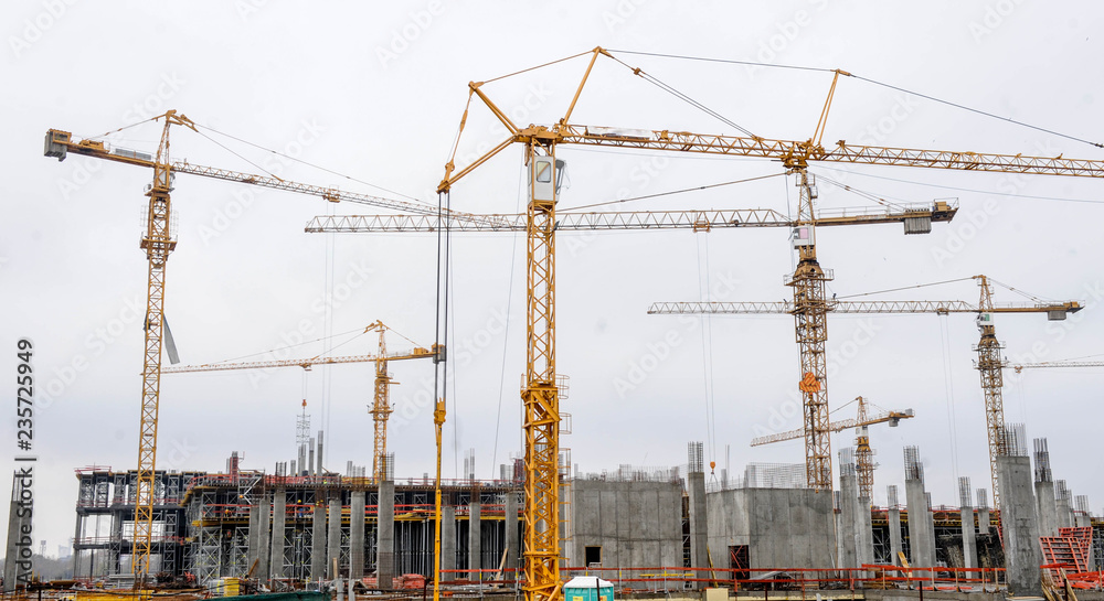 Building of large modern apartment scraper on the construction site Building of large modern apartment scraper on the construction site