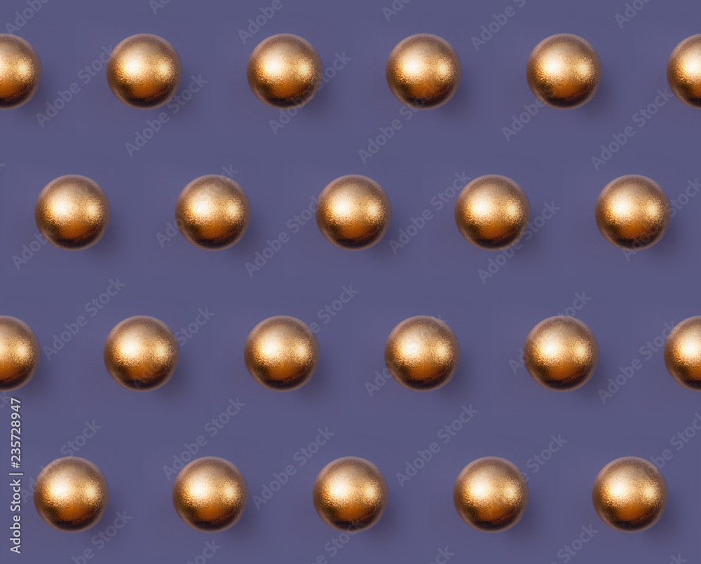 Golden Christmas ball pattern on violet background Golden Christmas ball pattern on violet background