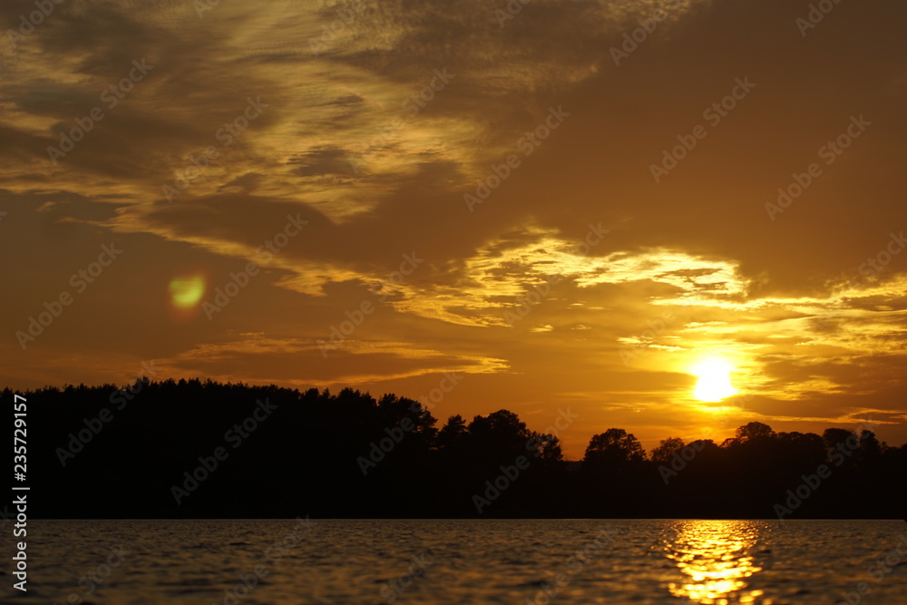 Golden sunset on a river in the nature