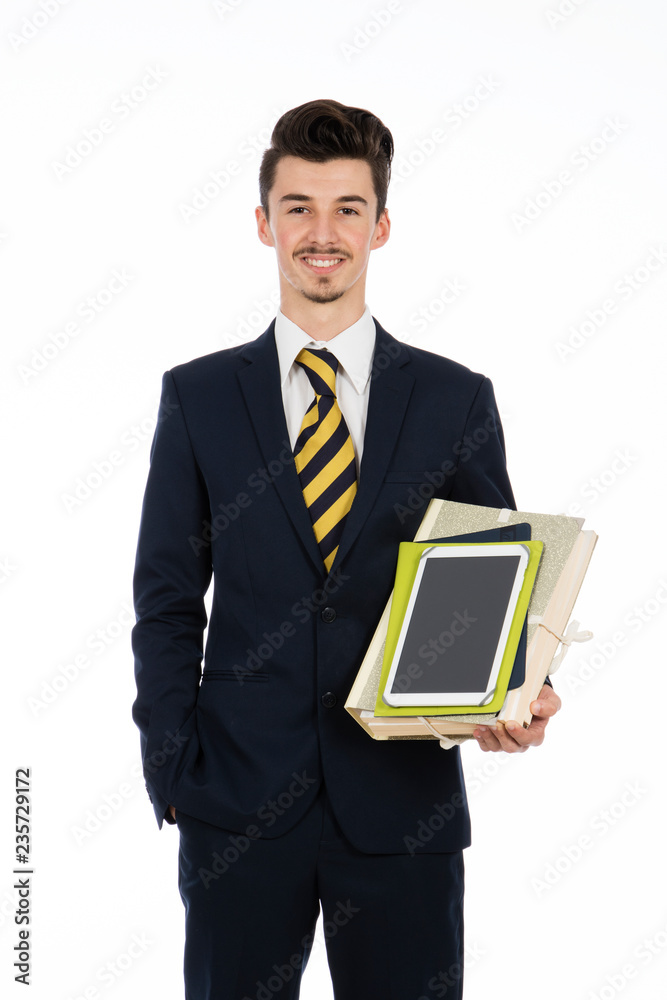 businessman standing in the studio with tablet and documents in his arms, she is wearing a black suit and white shirt businessman standing in the studio with tablet and documents in his arms, she is wearing a black suit and white shirt