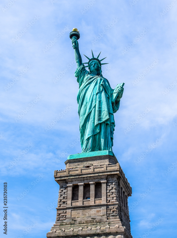 majestic Statue of liberty against a blue sky. New York, USA