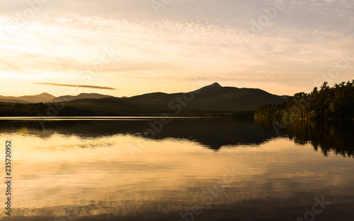 Fototapeta Naklejka Na Ścianę i Meble -  Sunset over the Winnipesaukee lake. Summer landscape in New Hampshire, USA
