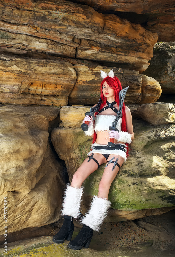 Beautiful female character with two swords in mountain area. Fashion model girl cosplay character