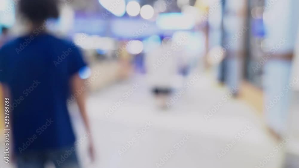 Defocused blur background. people go to a big supermarket Defocused blur background. people go to a big supermarket