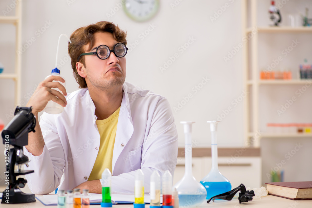Funny crazy chemist doing experiments and tests Funny crazy chemist doing experiments and tests