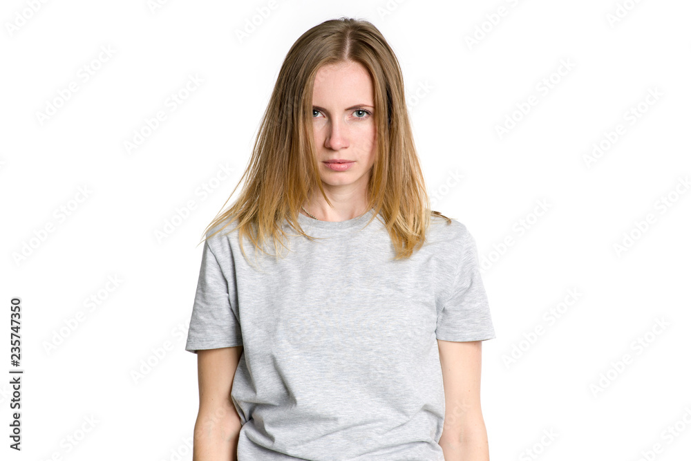 Sad young woman isolated on light background. Depression. Sad young woman isolated on light background. Depression.