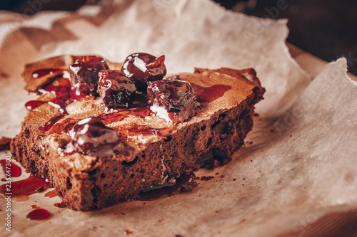 a slice of brownie pie, cherry jam on it