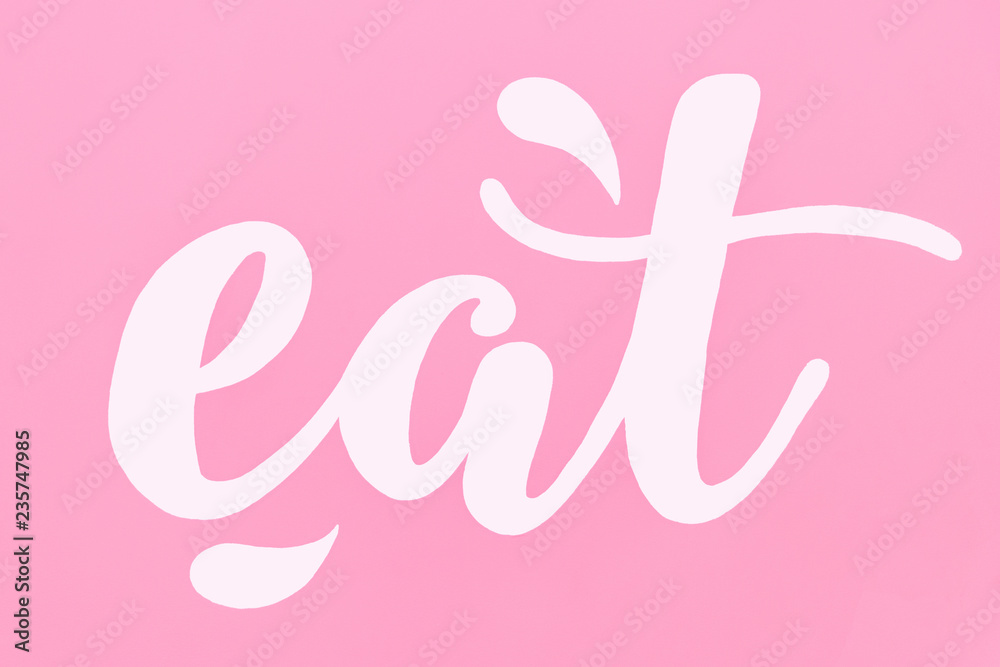 white word eat on pink background. Art of interior. Bacground and texture white word eat on pink background. Art of interior. Bacground and texture