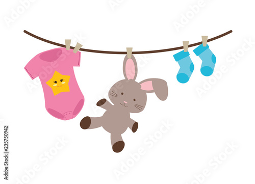 baby clothes and toy drying hanging