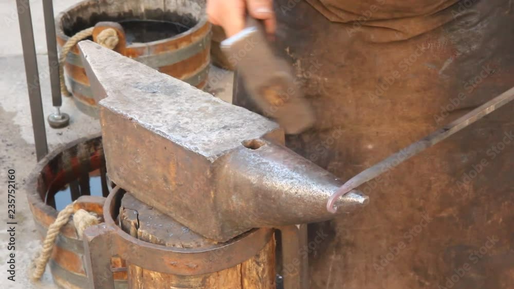Blacksmith working iron. Blacksmith working iron.
