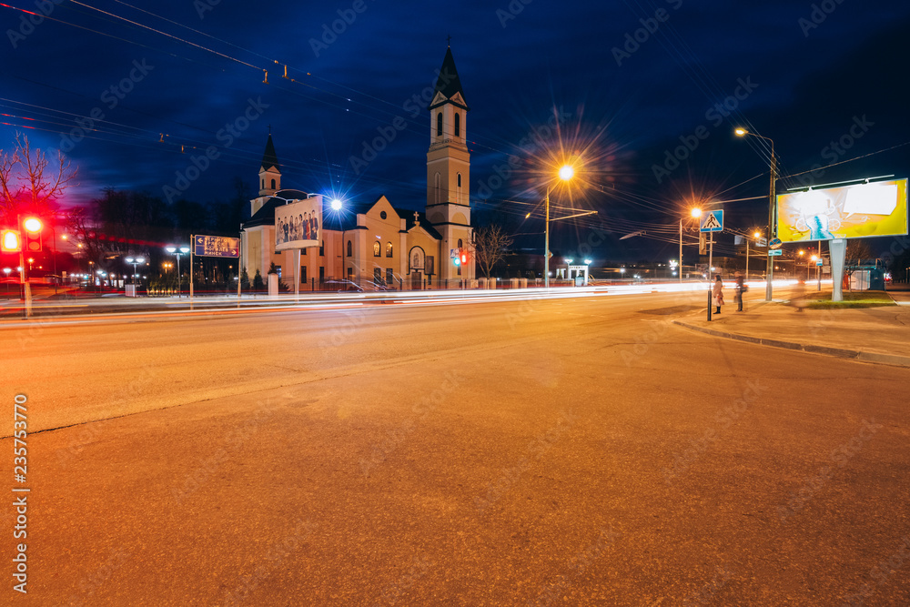 Soviet street at night with the Roman Catholic Church of the Mot