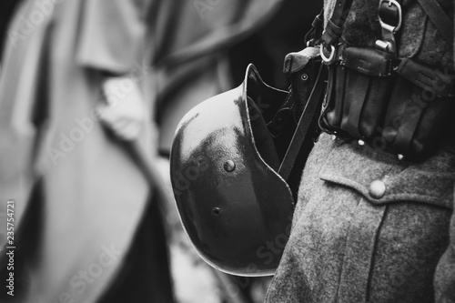 Helmet on the belt with the equipment of the Wehrmacht soldier