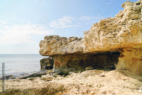 Grotto in the rock on the beach . Tarhankut. Crimea © amarinchenko106