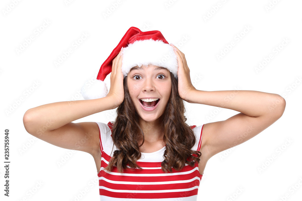 Emotional girl in santa hat isolated on white background Emotional girl in santa hat isolated on white background
