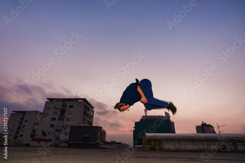 Parkour man doing blackflip jumping outdoor