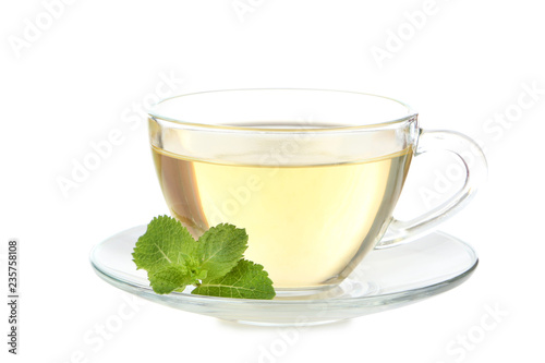 Cup of tea with mint leafs isolated on white background