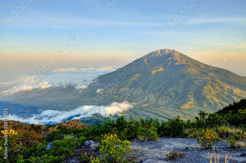 Fantastic view of Merbabu mountain at sunrise from Merapi volcano. Central Java, Indonesia
