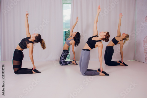 girl teaches Yoga young in the Studio photo