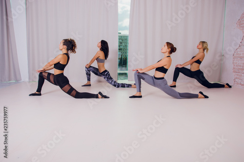 girl teaches Yoga young in the Studio photo
