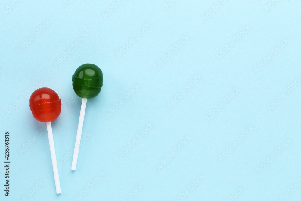 Sweet lollipops on blue background Sweet lollipops on blue background