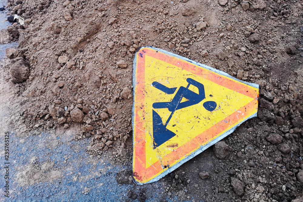 Road work sign under construction.Caution symbol.Yellow triangle safety sign warns about roadworks. Yellow safety sign warns about roadworks. Road works and renovation Road work sign under construction.Caution symbol.Yellow triangle safety sign warns about roadworks. Yellow safety sign warns about roadworks. Road works and renovation