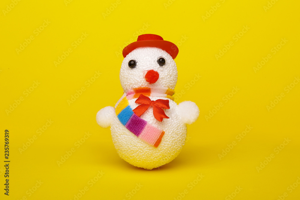 Christmas, New Year's snowman on a yellow background. Christmas background Christmas, New Year's snowman on a yellow background. Christmas background