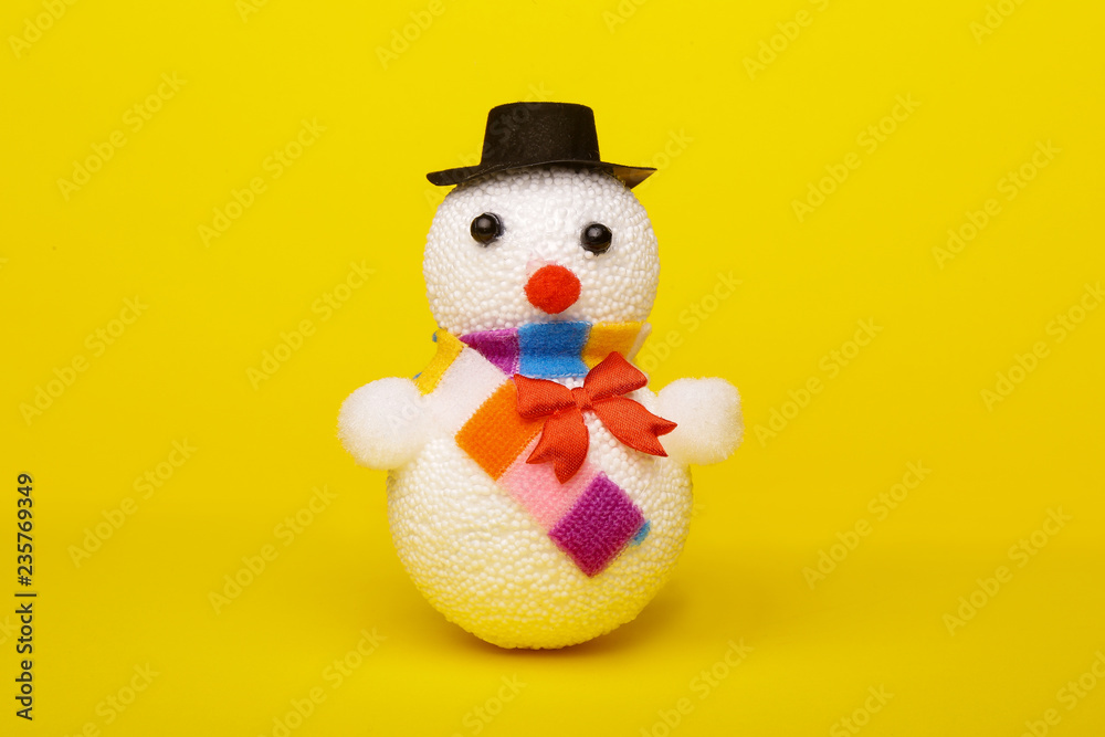 Christmas, New Year's snowman on a yellow background. Christmas background Christmas, New Year's snowman on a yellow background. Christmas background